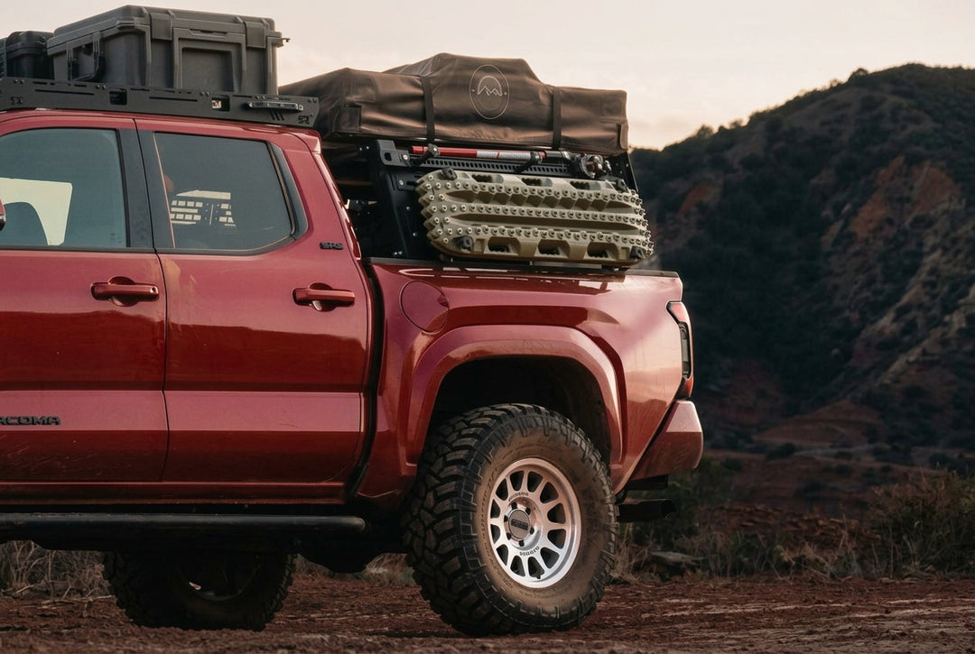 Toyota Tacoma overland build with rock sliders rooftop tent and storage