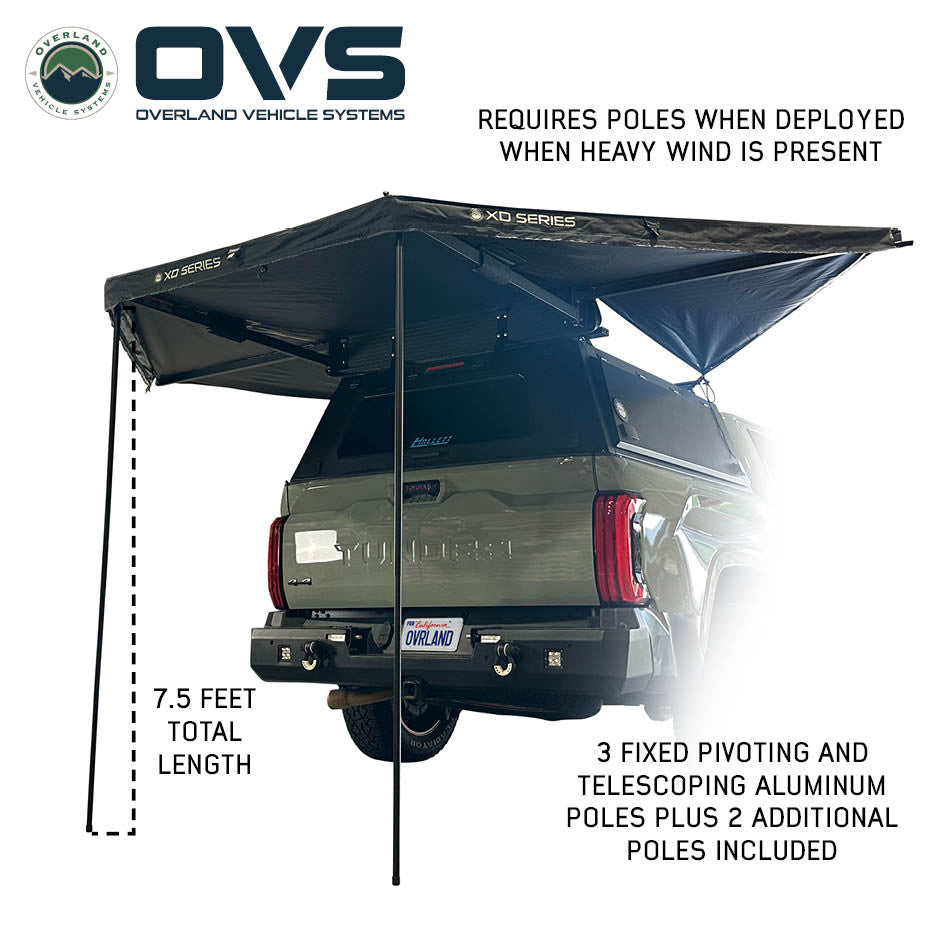 Black fabric OVS 315 awning at campsite