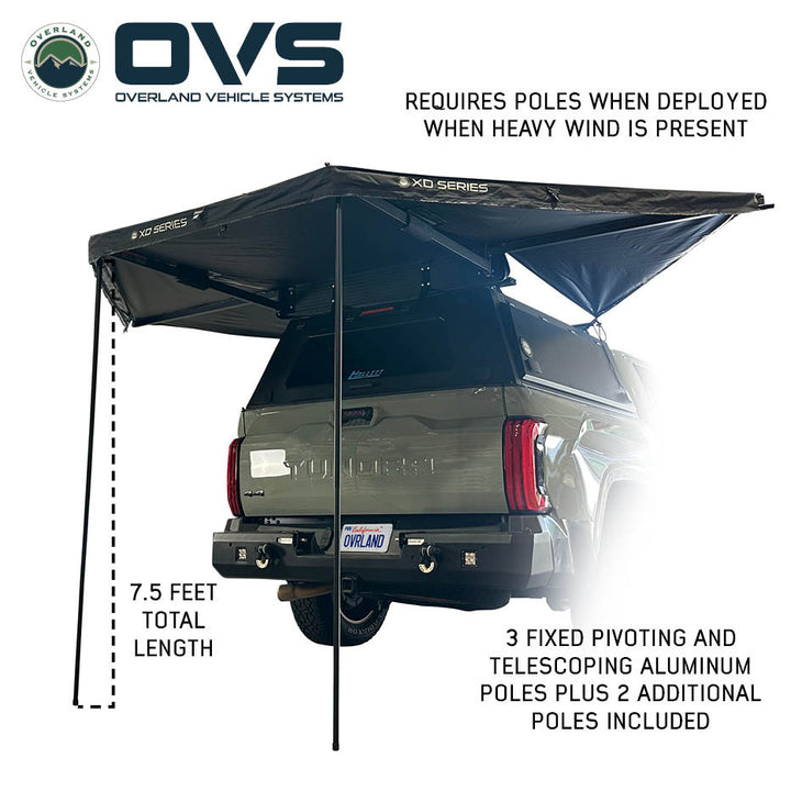 Black fabric OVS 315 awning at campsite