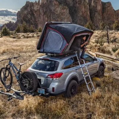 Freespirit Odyssey Roof Top Tent with a person sitting inside it