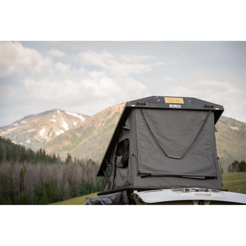 Eezi-Awn Stealth Hard Shell Roof Top Tent on vehicle with a mountain backdrop